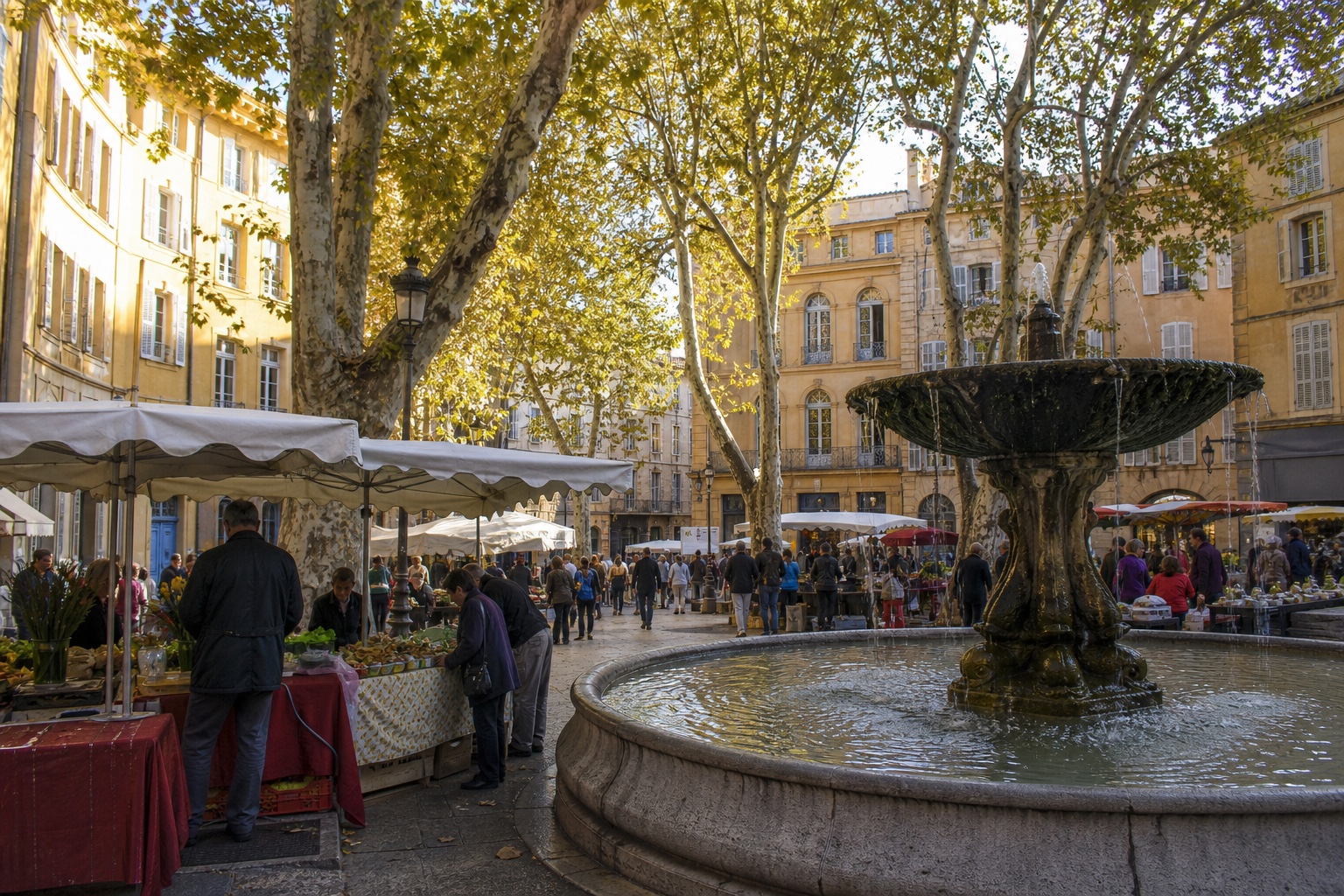 Aix-en-Provence market square, plane trees, fountain, and warm historic facades
