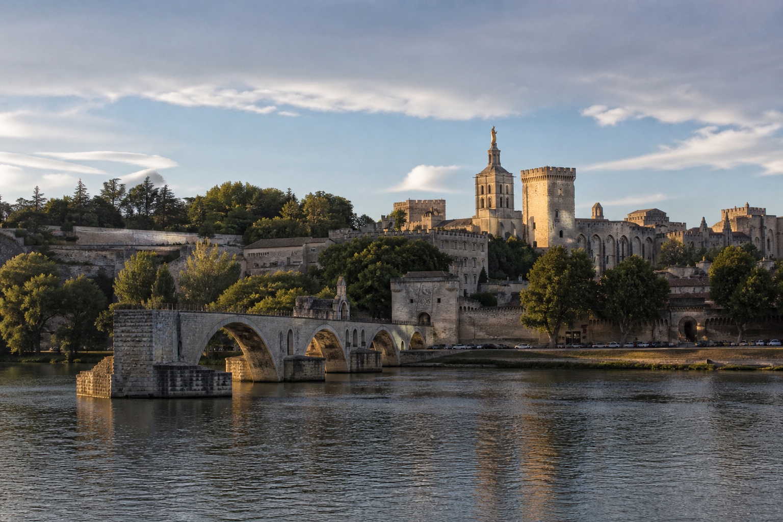 Avignon's Palais des Papes, ramparts, Rhône, and Pont Saint-Bénézet in warm daylight