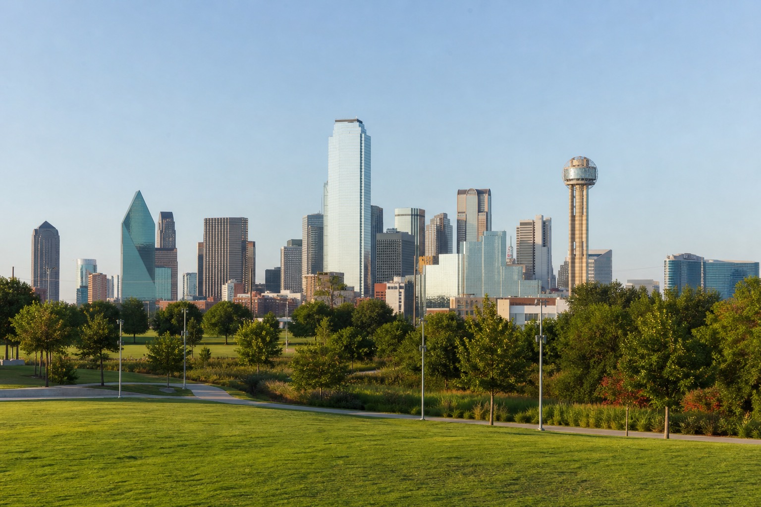 Dallas Arts District and downtown skyline viewed across a green urban park