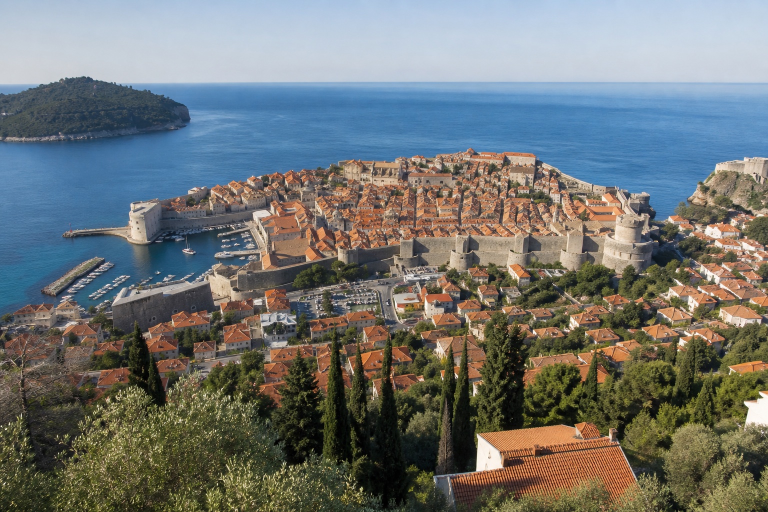 Dubrovnik's complete walled old town and terracotta roofs beside the Adriatic