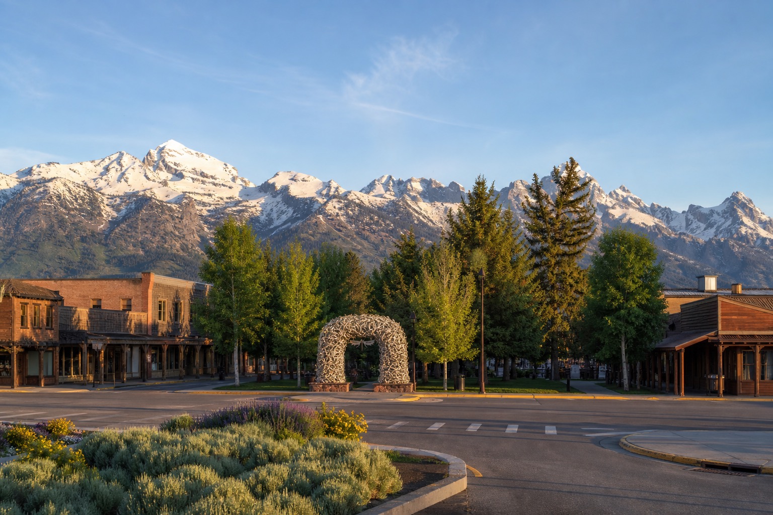 Jackson town square and distant Teton peaks in clear natural morning light
