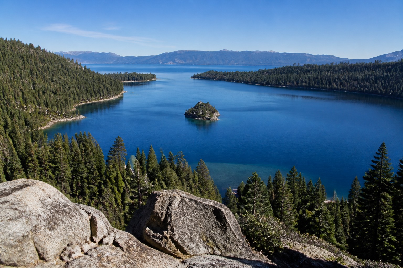 Emerald Bay and Lake Tahoe's blue water framed by Sierra granite and pine forest