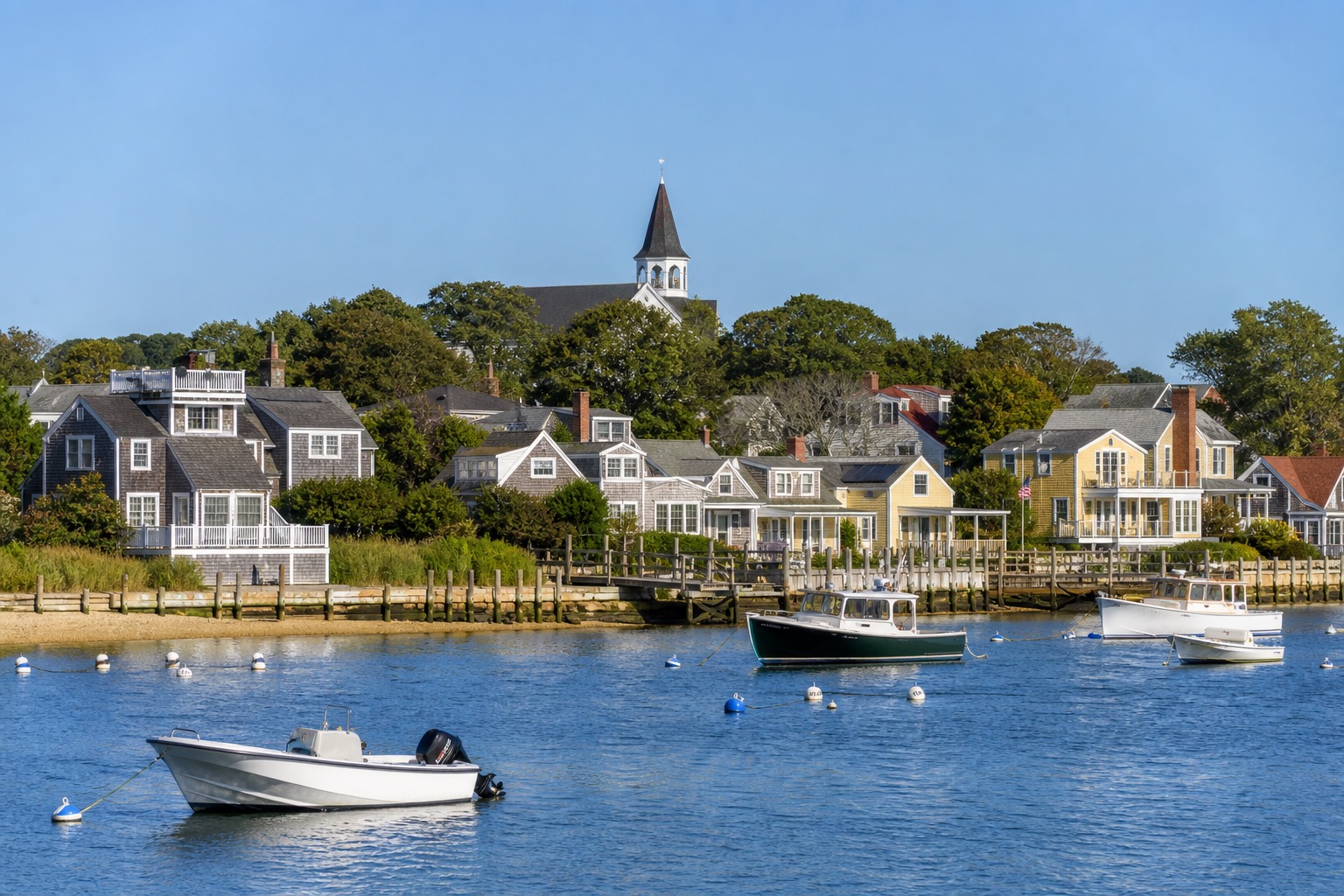 Martha's Vineyard coastal village, harbor and colorful historic cottages in natural morning light