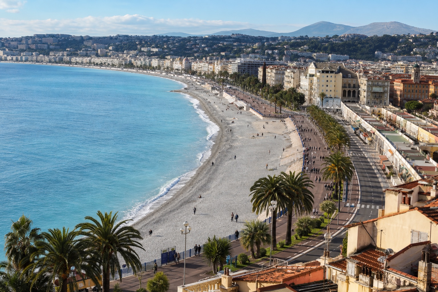 Nice's curved Mediterranean shore, Promenade des Anglais, palms, and city in clear morning light