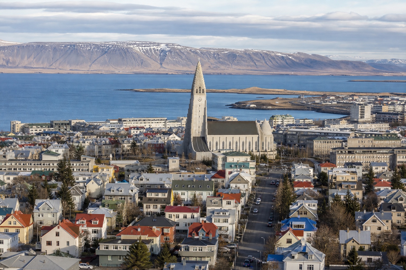 Reykjavík's colorful roofs, Hallgrímskirkja, harbor, and distant mountains