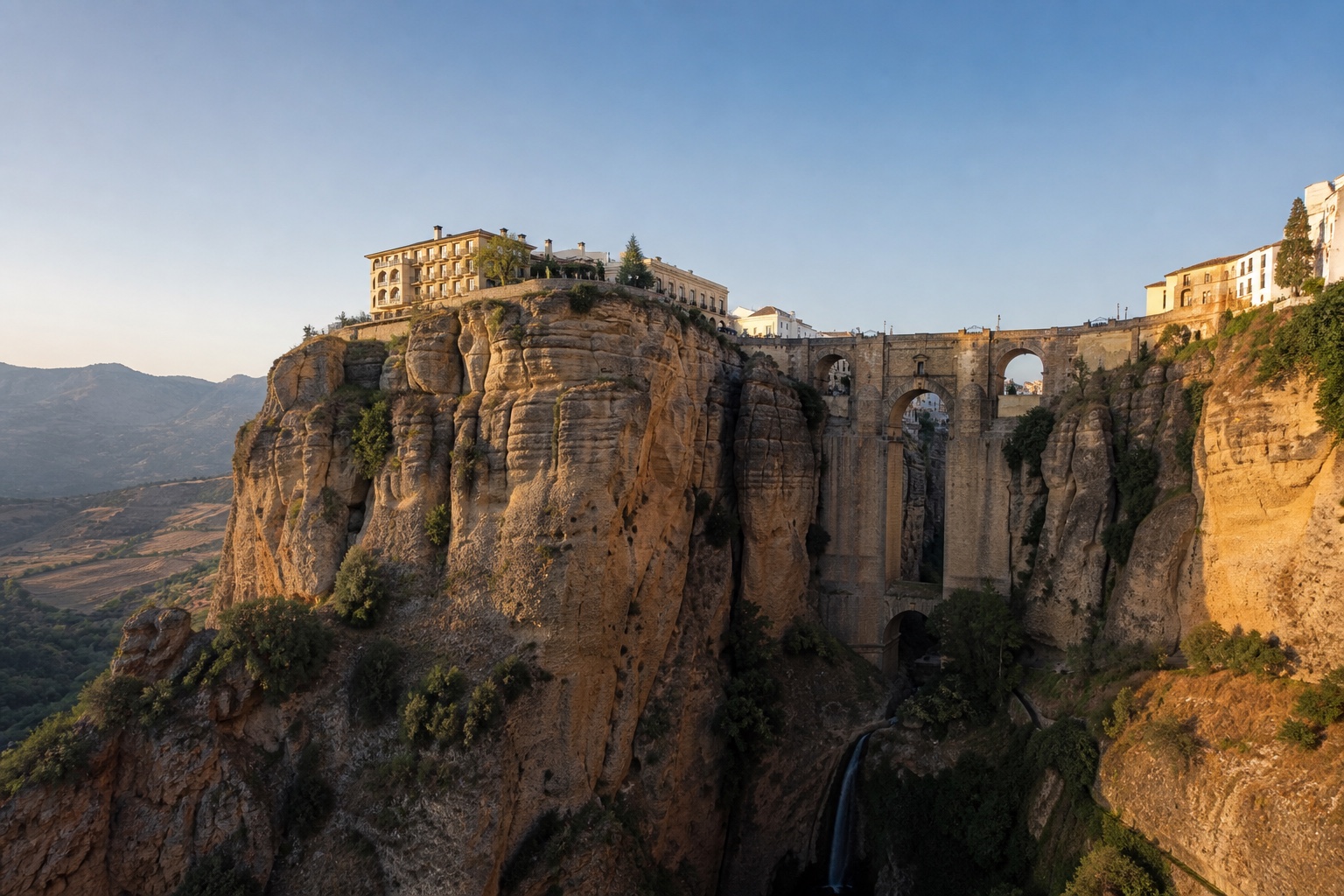 Ronda's Puente Nuevo spanning the deep El Tajo gorge in clear Andalusian light