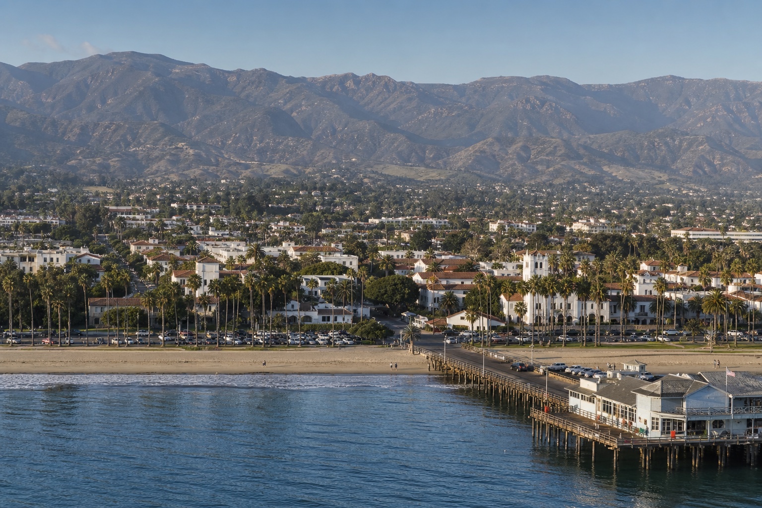 Santa Barbara's waterfront, pier, white and terracotta city, palms and Santa Ynez Mountains