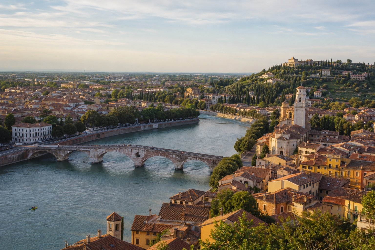Verona's Adige River curving past Ponte Pietra toward the historic city and Castel San Pietro